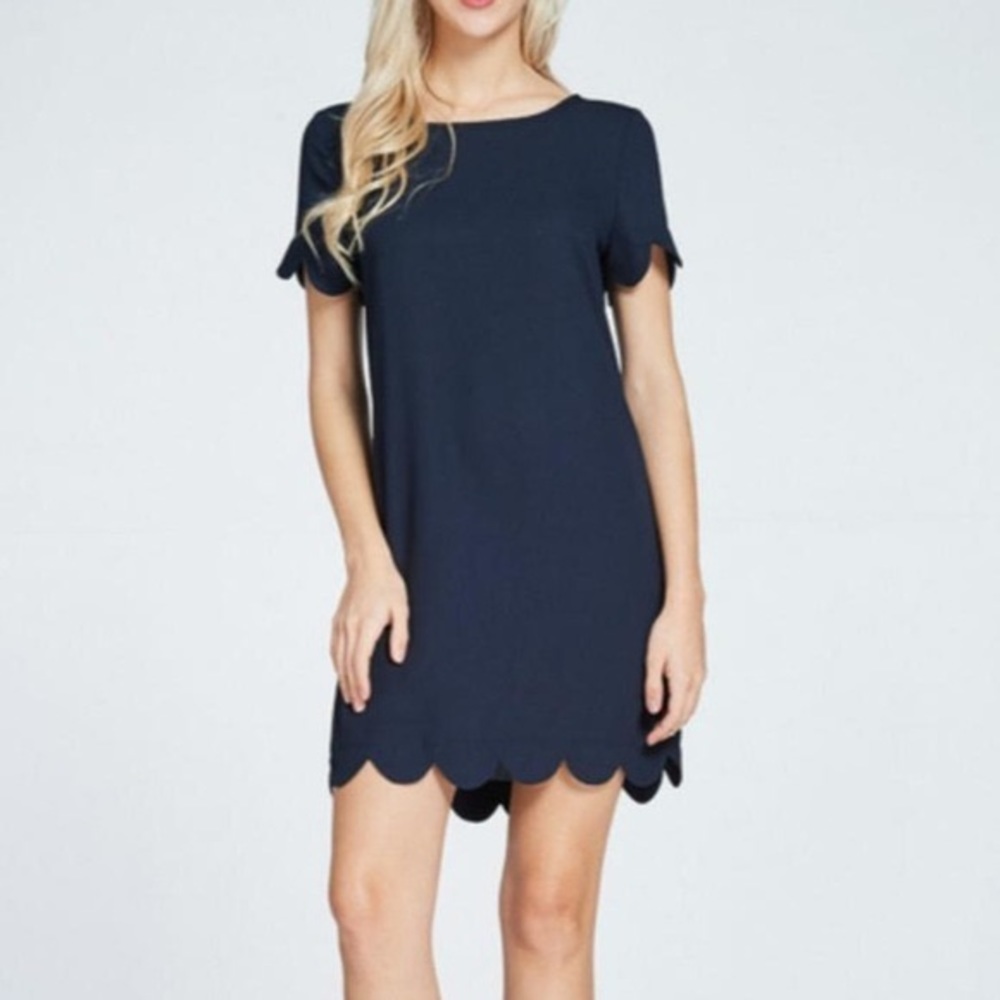 Like new Francesca's Rosette navy dress scallop sleeves & hemGold zipper Size M